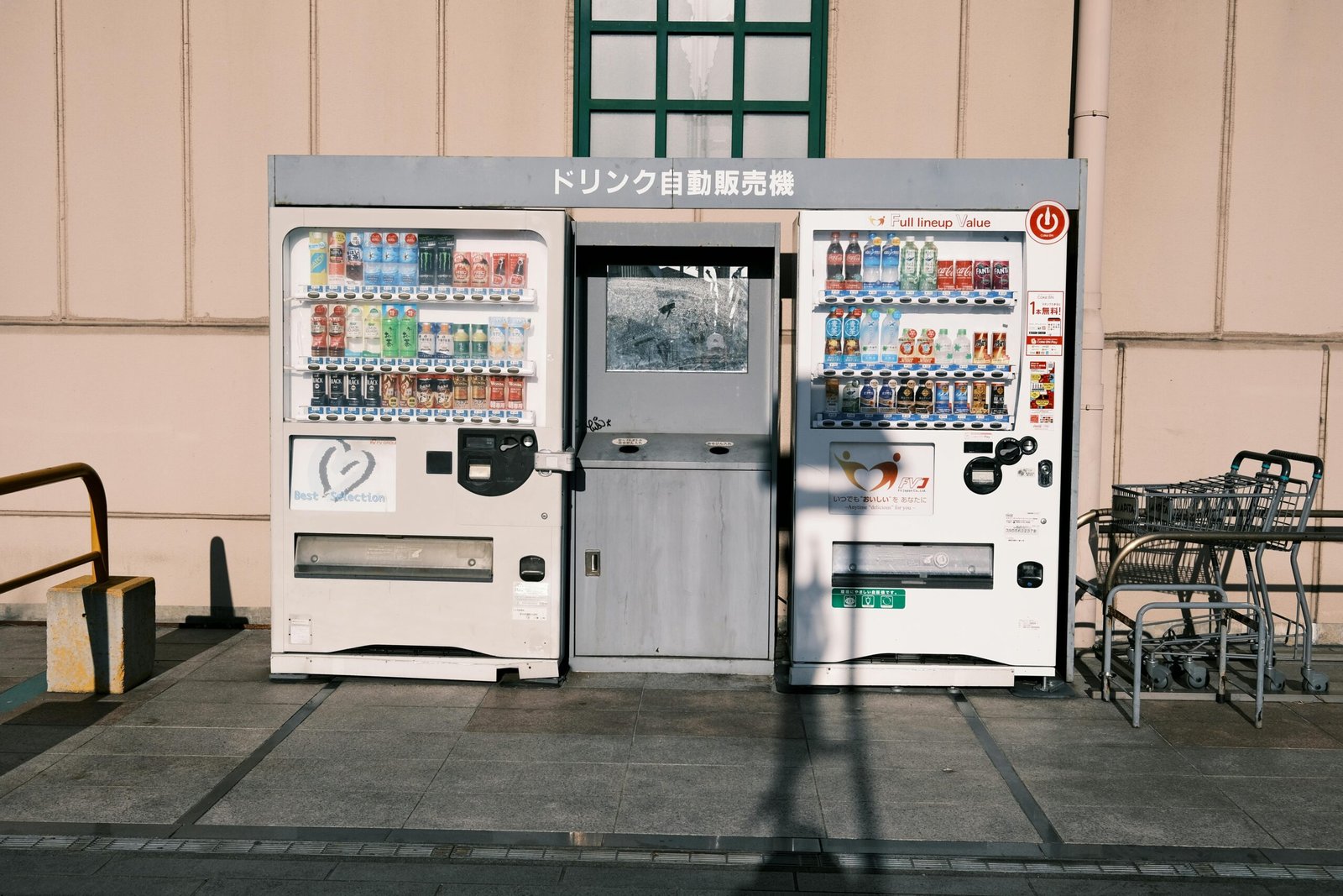 Friendly vending machine technician restocking smart snack machine